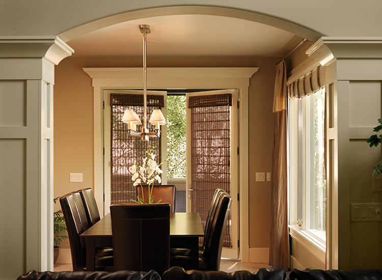 View of dining room leading to set of french doors