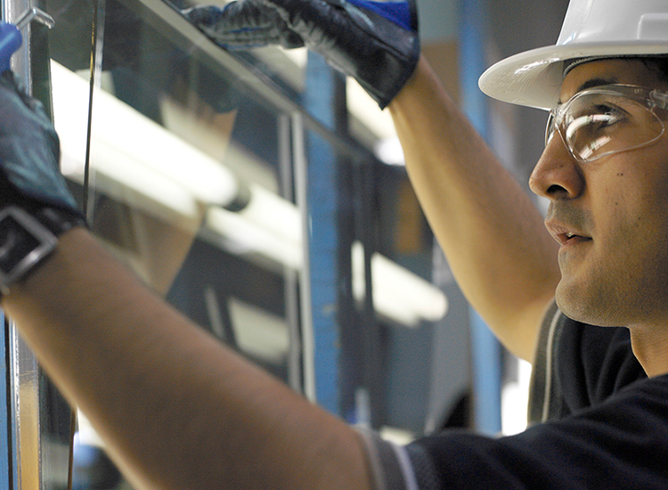 technician repairing a window